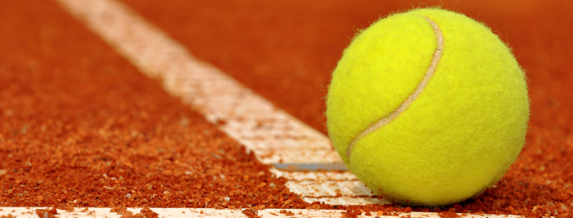 Tennis ball on a tennis clay court